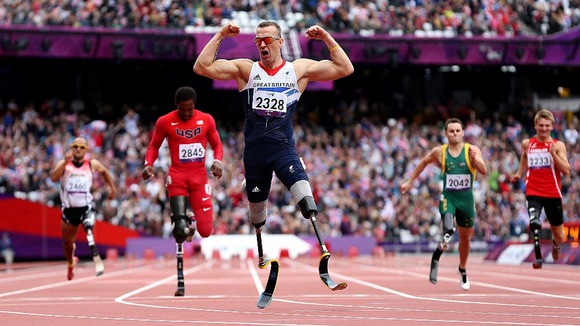 Richard Whitehead celebrates victory in the 200m sprint