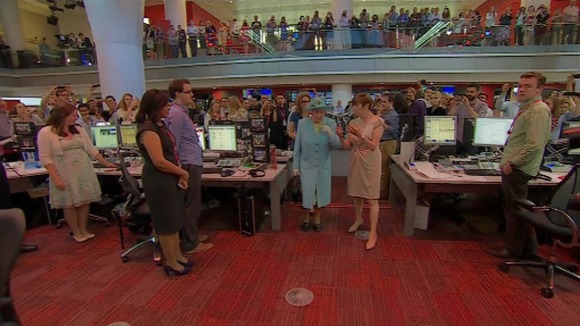The Queen was taken on a tour of the revamped newsroom in central London.