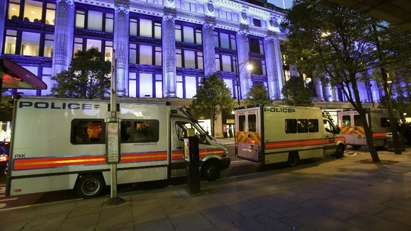 Police vans at the scene of a smash and grab robbery in Selfridges last night
