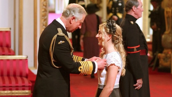 Cyclist Laura Trott receives her OBE medal from the Prince of Wales