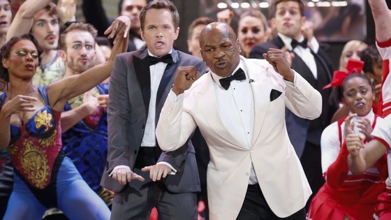 Host Neil Patrick Harris performs with boxer Mike Tyson.