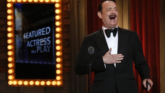 Actor Tom Hanks reacts before presenting an award at the Tonys.