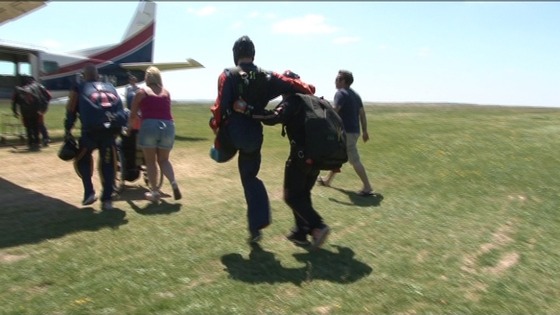 An injured solder hops towards the plane