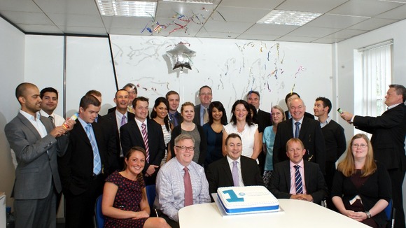 Staff celebrate the Cambridge & Counties Bank's first anniversary