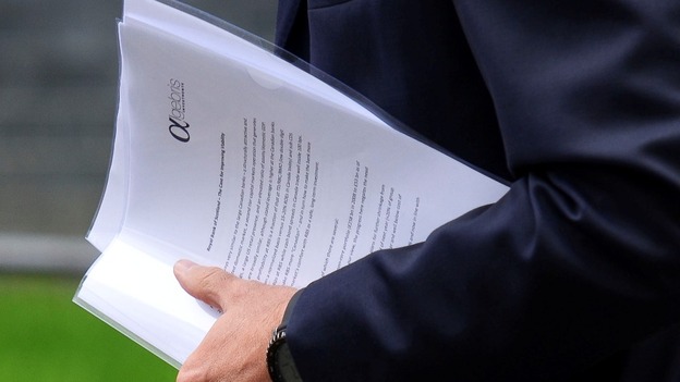 Davide Serra carrying papers outside Downing Street.