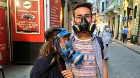 A couple wear gas masks in the Beyoglu district of Istanbul
