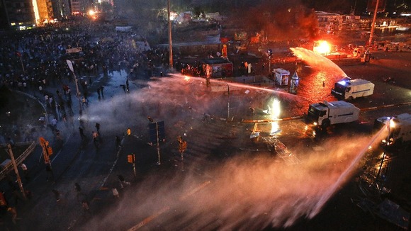 Water cannon are used to clear Taksim Square in central Istanbul