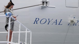 The Duchess of Cambrideg looks on as a magnum of champagne breaks against the ship's hull