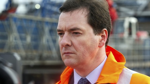 George Osborne on a building site as discussion about whether the construction figures have too much influence
