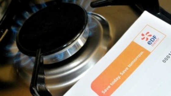 A gas hob with an EDF Energy bill next to it.