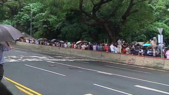 Dozens of protester gathered outside the US Embassy in Hong Kong.