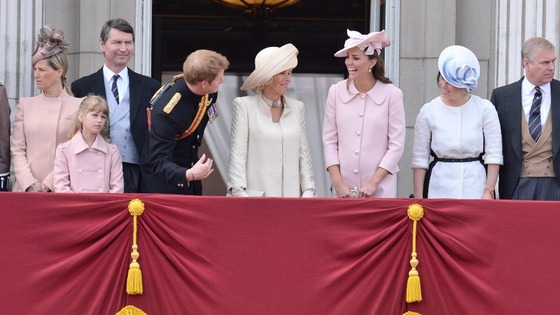 Prince Harry talks to the Duchess of Cornwall and Duchess of Cambridge on the balcony at Buckingham Palace.