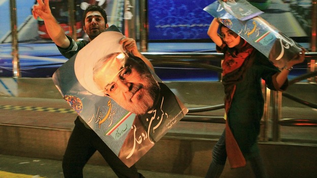 Supporters of moderate cleric Hassan Rouhani celebrate his victory in Iran's presidential election.