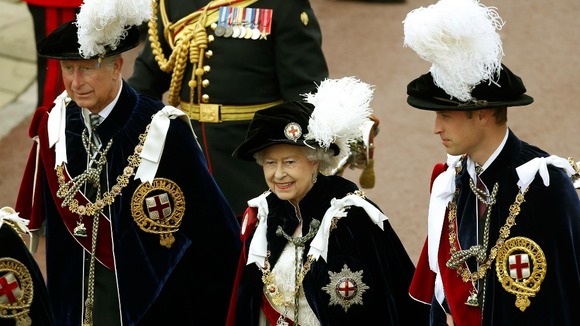 The Queen walks in procession with The Price of Wales and The Duke of Cambridge