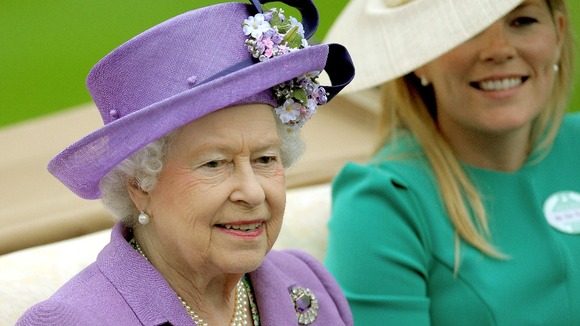 Queen Elizabeth II arrives with Autumn Phillips for day three of the Royal Ascot meeting