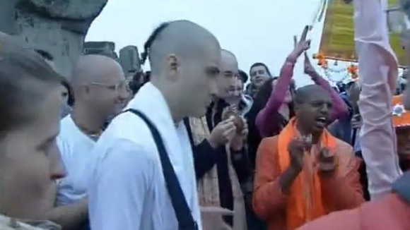 Members of the the Hare Krishna movement play music at the stone circle