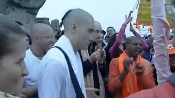 Members of the the Hare Krishna movement play music at the stone circle