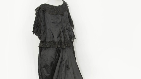 Gown of black silk worn by Queen Victoria.