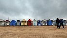 Wrapping up against the weather on the beach at Southend.