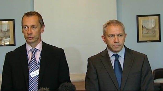 A spokesman for Sussex Police (L) and Nigel Pilkington of the CPS give a statement