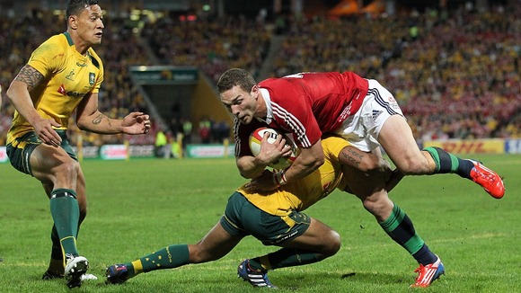 George North is tackled during the match against Australia