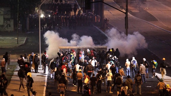 Demonstrators clash with police close to the Mineirao Stadium in Belo Horizonte on Saturday.