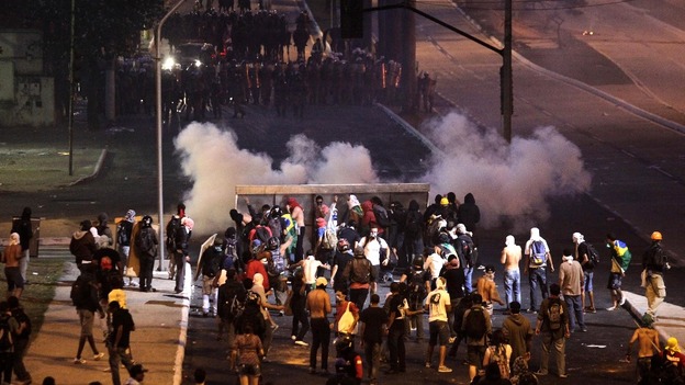 Demonstrators clash with police close to the Mineirao Stadium in Belo Horizonte on Saturday.