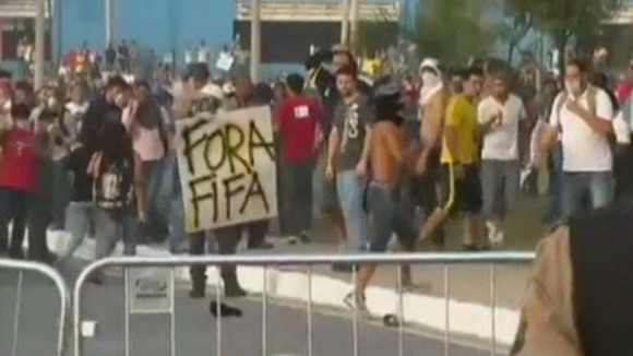 Sign held by protesters reads Fifa Out!