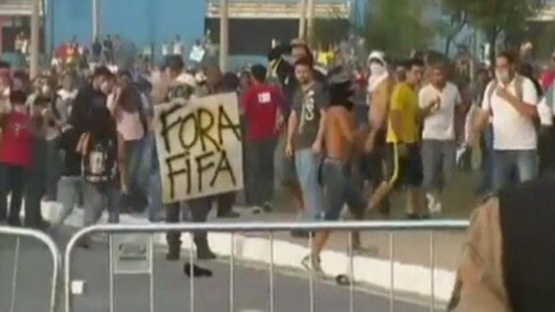 Sign held by protesters reads Fifa Out!