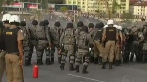 Riot police prevented protesters from getting near the football stadium and fired tear gas