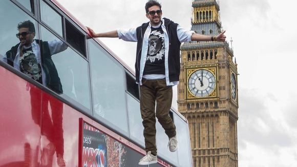 The star traveled through the capital on a moving double decker