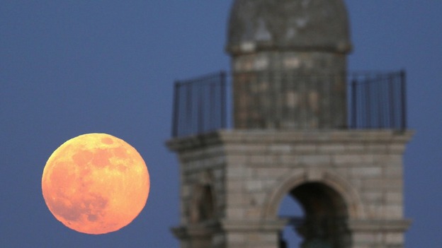 Moon is seen rising behind the Mar Elias Greek Orthodox Monastery in Jerusalem