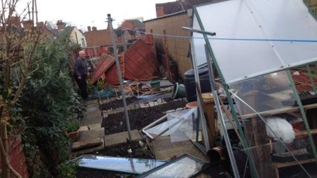 Resident Andrew Sheriff surveys damage to his garden