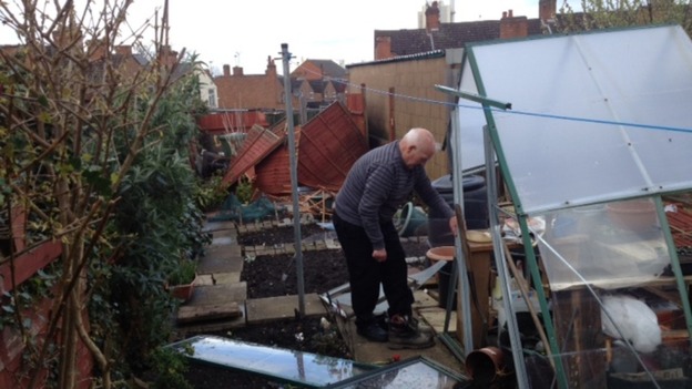 Resident Andrew Sheriff surveys damage to his garden