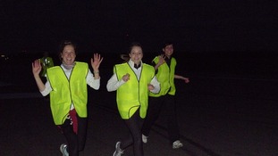 Runners on their early morning charity run at Stansted Airport