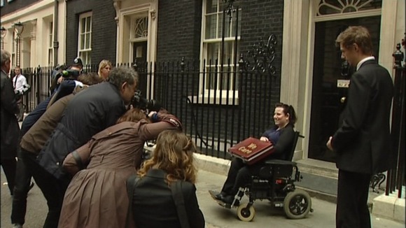 Angela Murray outside Downing Street handing in petition