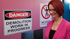 Julia Gillard walks past a demolition sign during a visit Forrest Primary School in Canberra last month.