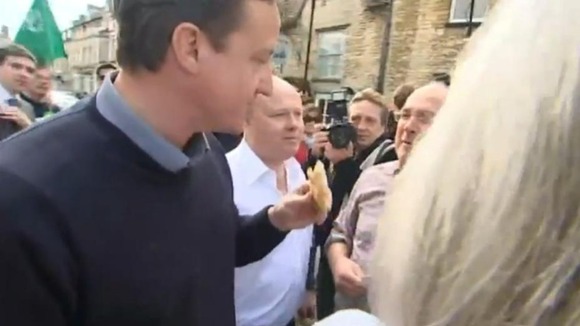 David Cameron eating a pasty at a famers' fair in Oxfordshire