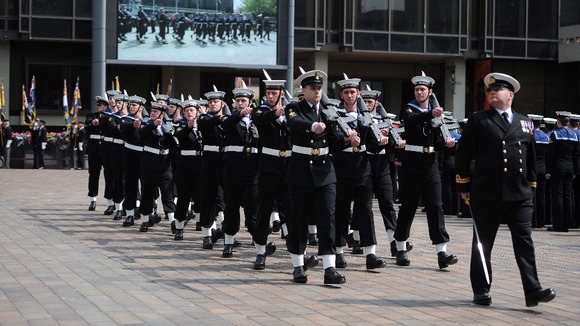Sailors parade outside the Guildhall