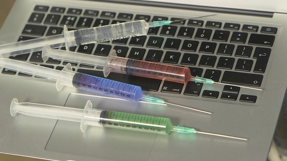 Syringes on a laptop