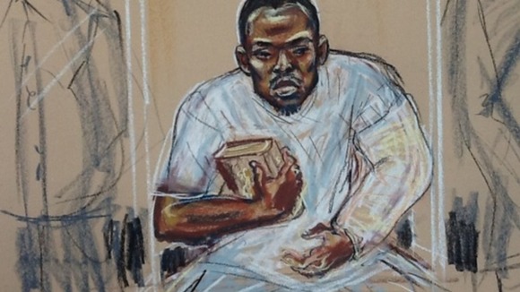 Michael Adebolajo seen during a previous court appearance holding a copy of the Koran