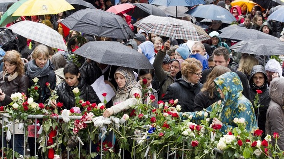 People lays flowers near the entrance the courthouse in Oslo where Anders Behring Breivik is standing trial.