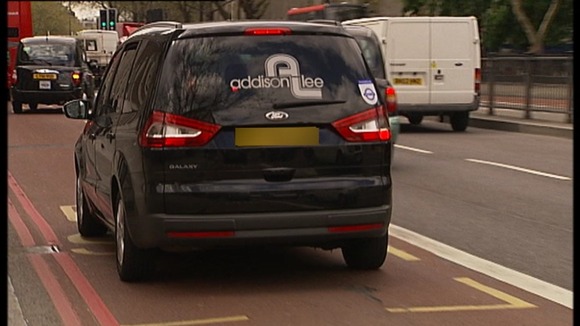 Addison Lee car driving in bus lane