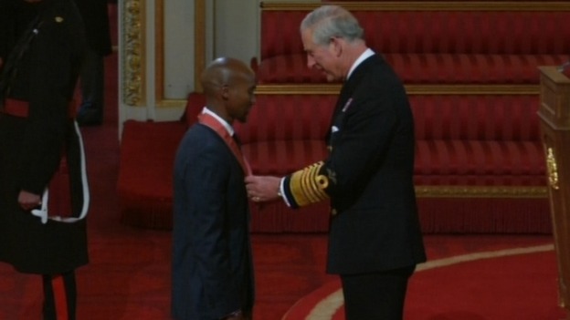 Olympian Mo Farah receives his CBE from Prince Charles at Buckingham Palace.