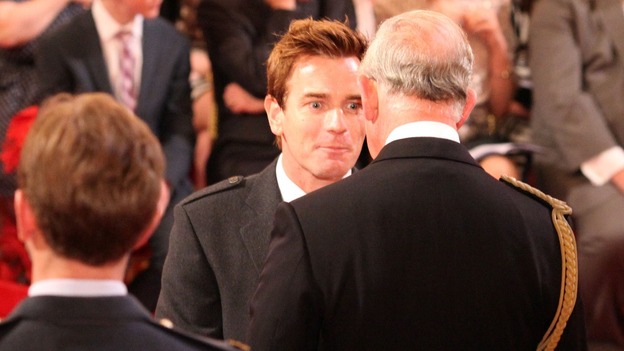Actor Ewan McGregor speaks to Prince Charles as he receives his OBE at Buckingham Palace.