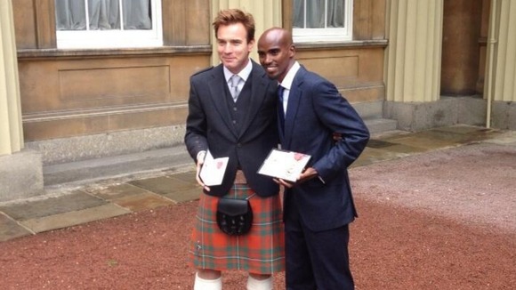 Ewan McGregor and Mo Farah show off their honours outside Buckingham Palace.