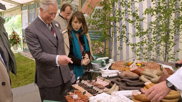 The Prince of Wales inspects sausages at a symposium for highlighting the development of regional produce
