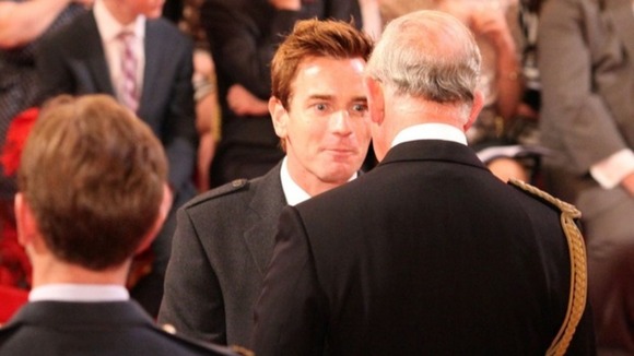 Ewan McGregor speaks to Prince Charles as he receives his OBE