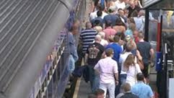 Passengers leave a train on the Real Ale Rail Trail