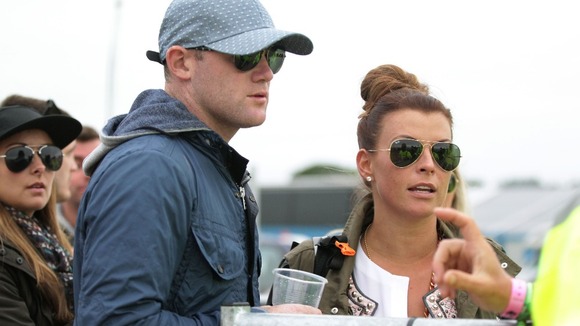 Wayne and Coleen Rooney are stopped by security at Glastonbury